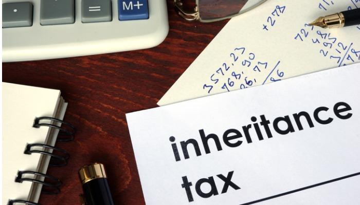 inheritance-tax-written-on-a-paper-financial-concept-picture-id641350496-2